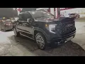GMC DENALI ULTIMATE WITH CHROME WHEELS AT NIGHT
