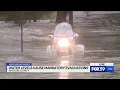 Man drives motorcycle into floodwaters during live shot in Anderson