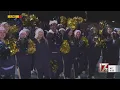 Lee County High School cheer team celebrates Sanford Christmas Parade