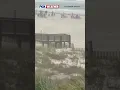 SANDY WINDS Beachgoers At Orange Beach Alabama Were Met With Less-than-ideal Conditions