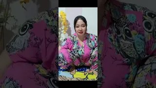 beautiful mother gemoy is ironing her clothes again while squatting