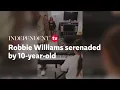 Robbie Williams serenaded by 10-year-old daughter in home video