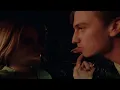 Romantic couple inside a car at night