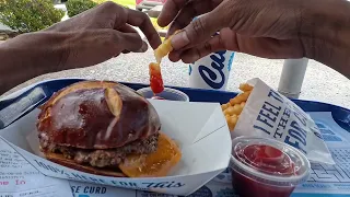 CULVER S POV FRIED PICKLE PREZEL BUN PUB BURGER WITH FRIES AND ORANGE FANTA LIMITED TIME ONLY