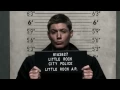 Supernatural funny scene with Sam and Dean having mug shots taken