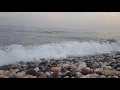 Sea Pebbles in the beach, stone sound, gravel stones with water, waves crashing on rocks