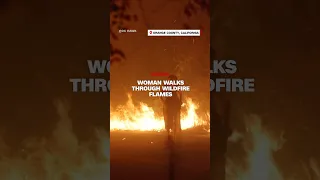 Woman Walks Through Wildfire Flames 