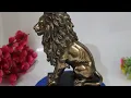 Polyresin Lion Sitting Statue on black base Decorative Showpiece - 23 cm Polyresin Brown