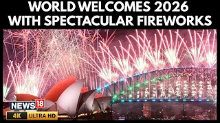 world welcomes new year 2026 people erupt in joy as they glimpse spectacular fireworks show 4k