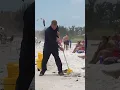 Janitor Mopping The beach