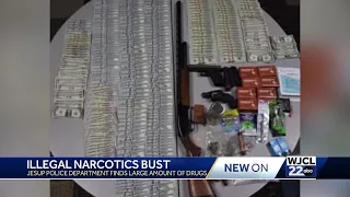 Execution of search warrants on two Jesup properties turns up drugs 3 guns nearly 20K in cash