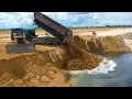 Lagu Incredible!, 25-ton dump truck fills large lakes and flooded land with KOMATSU Dozer, pushes rocks