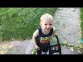 Ehren mowing lawn with Dad