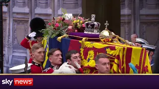 queens coffin enters westminster abbey