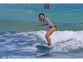 Hilary Duff parades her toned pins in skimpy bikini bottoms as she tries her hand at surfing