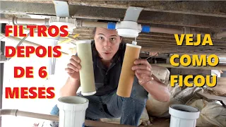 Trocando os filtros de água do sistema de filtragem da casa container