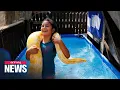 8-year-old Israeli girl swims with her 11-foot long pet python