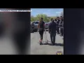 Phoenix police officer shot at gas station returns home