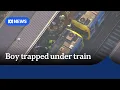 Boy in critical condition after being trapped under train at North Melbourne station ABC NEWS