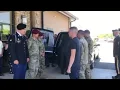 The casket of Army Spc Luis Herrera arrives at Beam Funeral Home