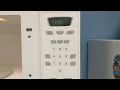 How to set the clock on a Whirlpool microwave oven model AMV1150VAW-5