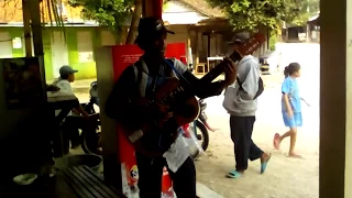 Memori Berkasih - Covered by Street musician at the gate of Sadranan Beach (local guide)