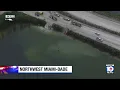 Divers searching for missing person following construction vehicle accident in Miami-Dade