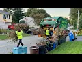WM Garbage Truck Packing A Masive Yard Waste Pile