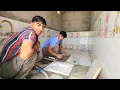 Ali s bathroom and toilet floor tiling and Abu s construction of a sewage well