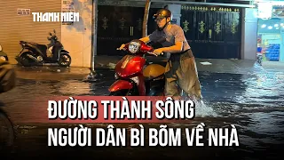 Đường thành sông sau mưa lớn ở TP.HCM: Người dân than "mệt mỏi nhân đôi" khi bì bõm về nhà