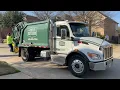 Garbage Truck Compacting Loads of Trash Frontier Waste Solutions Peterbilt 548 McNeilus M5