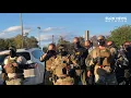 Marchers react after being arrested during early voting event in Graham