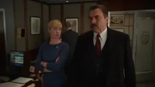 Abigail Hawk in nylons and a dark blue long sleeve dress