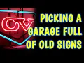 Treasure trove of vintage signs advertising Picking a packed garage