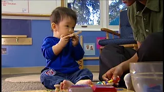 InfantExploresShakerAndPUzzle 