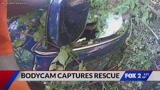 Police bodycam shows officers lift car off trapped mother