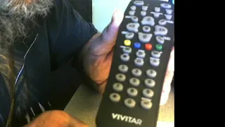 How to program a Vivitar mid 3290318 8 device remote control