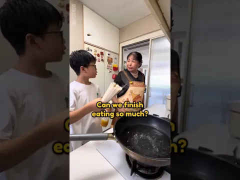He was learning to cook noodles from his mom!