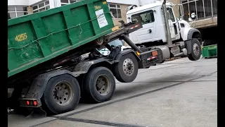Crazy roll-off truck driver