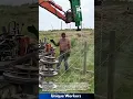 Download Lagu Barbed wire fencing installation: farmer using machine for pasture fencing