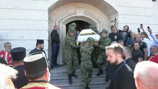 Soldiers carry Bosnian Serb war criminal's coffin during funeral procession in Belgrade | AFP