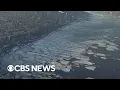 U S Coast Guard rescuing ships stuck in frozen New York waterways after winter storm