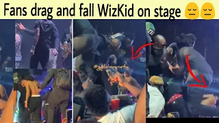 moment fans drag and fall wizkid off stage while performing at abuja