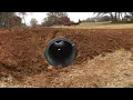 INSTALLING A 20-FOOT CULVERT PIPE BRIDGING THE CREEK