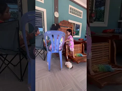 The baby walks towards her siblings.
