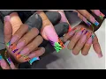 Lisa Frank inspired acrylic nails fenchtips with animal print