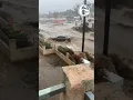 Vehicles carried away by floodwaters in San Diego California