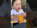 Baby tries orange juice for the first time 🍊