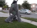 Two horned four legged hairy scary homemade costume on stilts