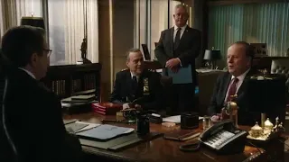 Abigail Hawk opening the door while wearing a black dress suit and pantyhose
